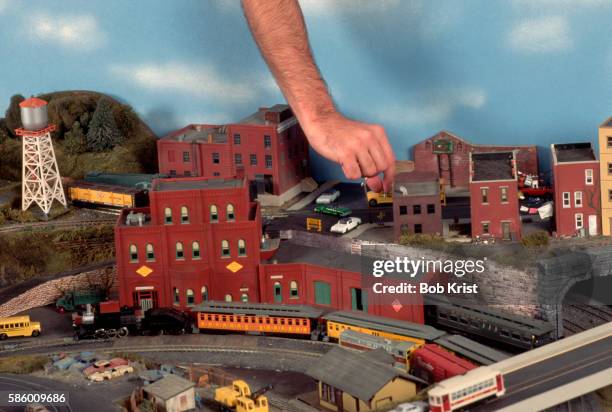 model train enthusiast setting up environment for train to run through - model railway stock pictures, royalty-free photos & images