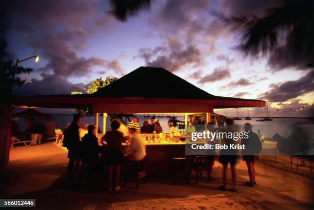 anegada reef hotel bar at sunset - anegada stock-fotos und bilder