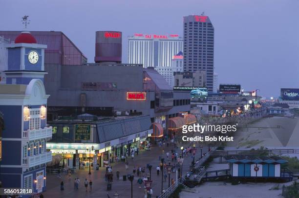 the boardwalk at dusk - atlantic city stock pictures, royalty-free photos & images