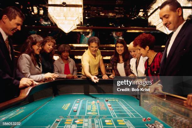 craps table at condado plaza casino - casino worker stockfoto's en -beelden