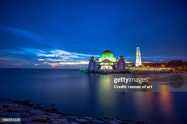 strait mosque during sunset - masjid selat melaka stock pictures, royalty-free photos & images