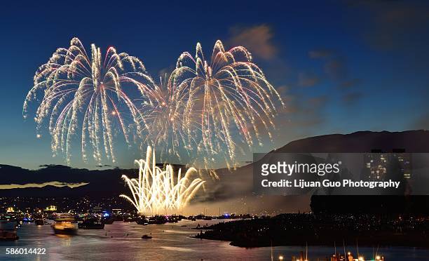 celebration of lights, fireworks display at english bay, vancouver, bc - english bay stockfoto's en -beelden
