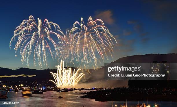 celebration of lights, fireworks display at english bay, vancouver, bc - english bay stock pictures, royalty-free photos & images