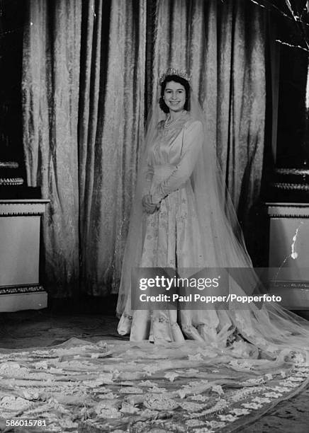 Princess Elizabeth pictured wearing her wedding dress, designed by Norman Hartnell, 1947.