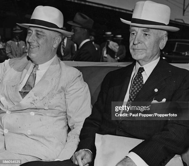 President of the United States, Franklin D Roosevelt rides in an open top car with Secretary of State, Cordell Hull in Washington DC, October 27th...