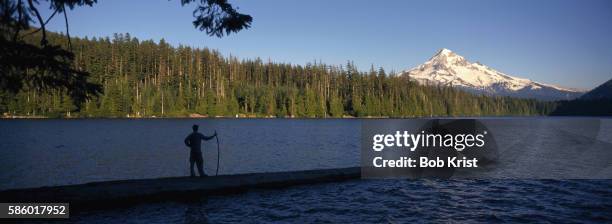 hiker on pier over lost lake - lost lake stock pictures, royalty-free photos & images