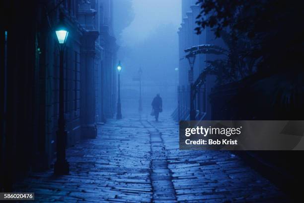 figure traveling through pirate's alley - vintage haunting stock pictures, royalty-free photos & images