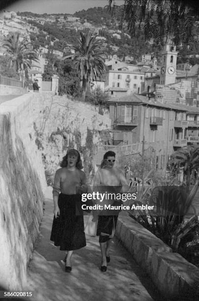 Roberta Cowell , out walking with a friend, March 1954. Roberta was once a Spitfire pilot, prisoner of war, racing motorist, husband and father of...