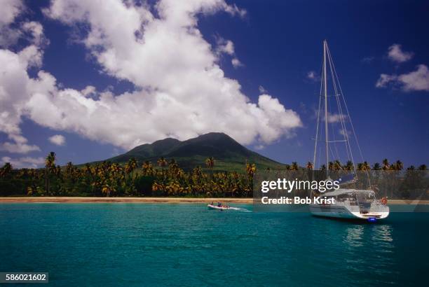 sailboat off the coast of nevis - saint kitts and nevis stock pictures, royalty-free photos & images