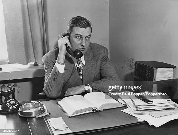 Former Army Lieutenant Commander Franklin Delano Roosevelt, Jr, son of President Franklin D Roosevelt, uses the telephone at his newly opened law...