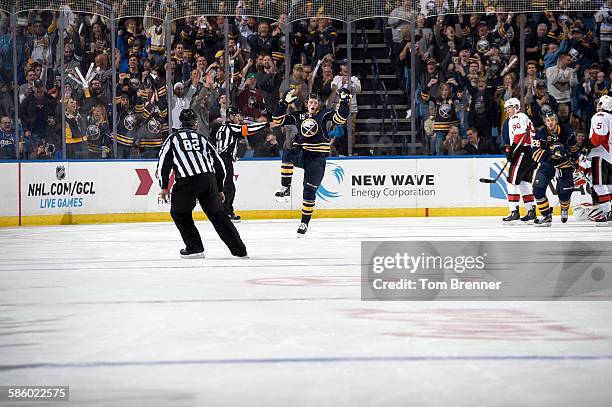 Jack Eichel of the Buffalo Sabres celebrates after scoring his first career goal during a game against the Ottawa Senators at the First Niagara...