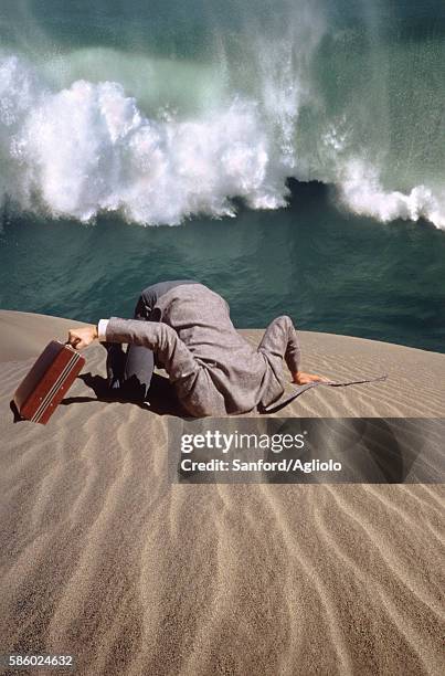 businessman with head buried in sand - in case of discomfort fotografías e imágenes de stock