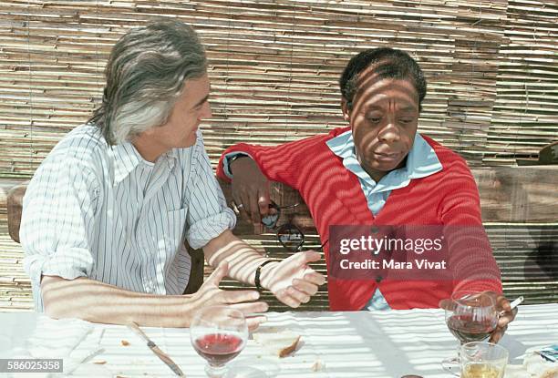 Author James Baldwin converses and drinks wine with Charles deBartillat. Nice, France.