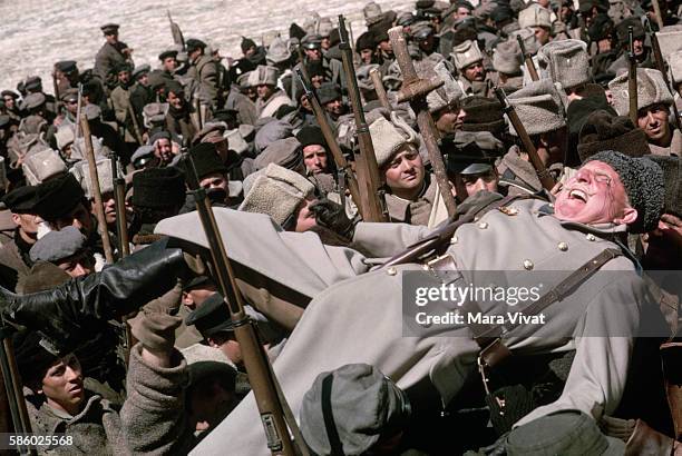 Actors portraying soldiers carry another for a scene in the movie Dr. Zhivago.