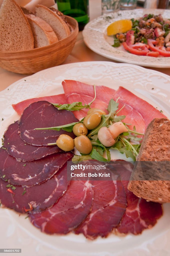 Plate of Karst prosciutto and wild boar salami