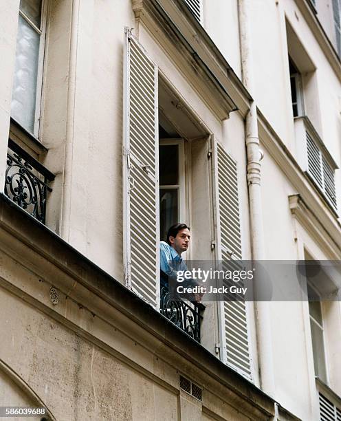 Fashion designer Marc Jacobs is photographed for InStyle Magazine leaning out the window of his home in New York City.