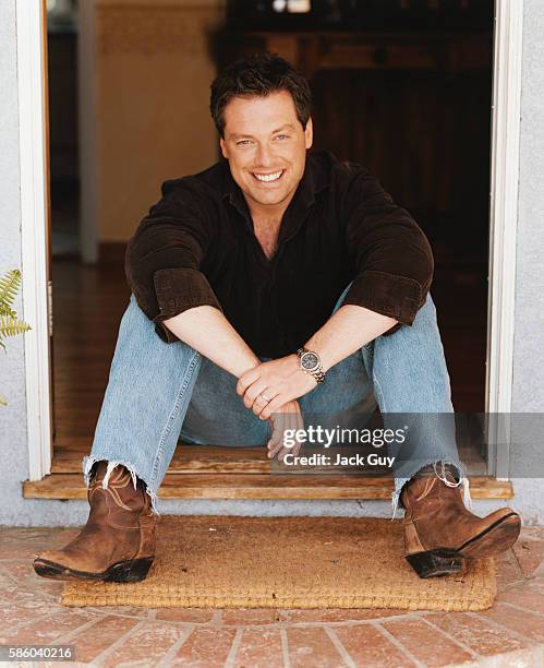 Game show host Todd Newton is photographed for InTouch Weekly in 2003 at home in Los Angeles, California. PUBLISHED IMAGE.