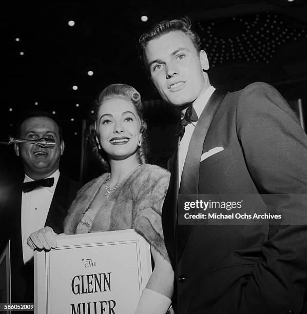 Actor Tab Hunter with guests attends the premiere to "The Glen Miller Story" in Los Angeles, California.