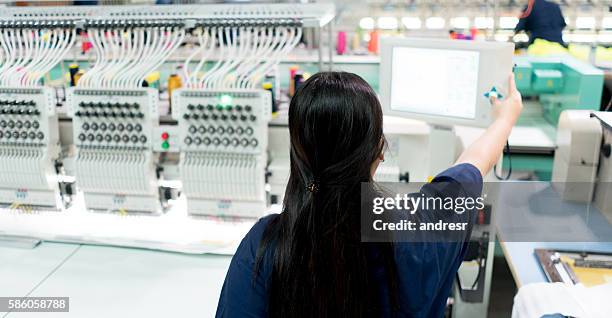 woman operating the embroidery machine - embroidery stock pictures, royalty-free photos & images