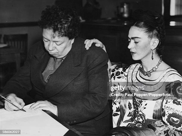 Mexican painters and spouses Diego Rivera and Frida Kahlo Rivera pictured applying for a new marriage license following their previous divorce, San...