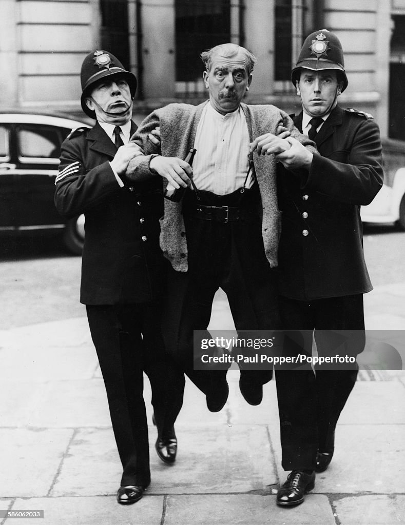 Brian Rix Actor Larry Noble is lead away by actors Leo Franklyn and Brian Rix ...