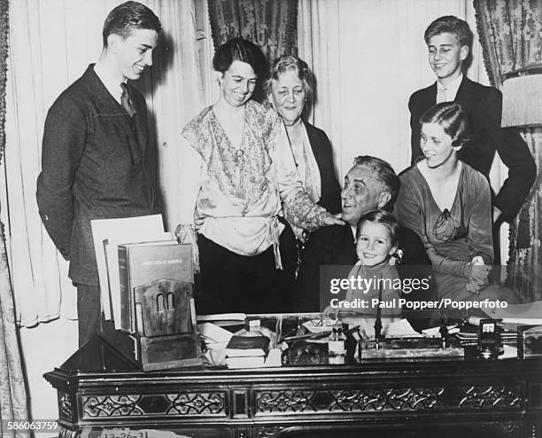 Portrait of Governor Franklin D Roosevelt and his family Franklin Jr, Eleanor Roosevelt, Sara Roosevelt, FDR holding granddaughter Anna Dall on his...