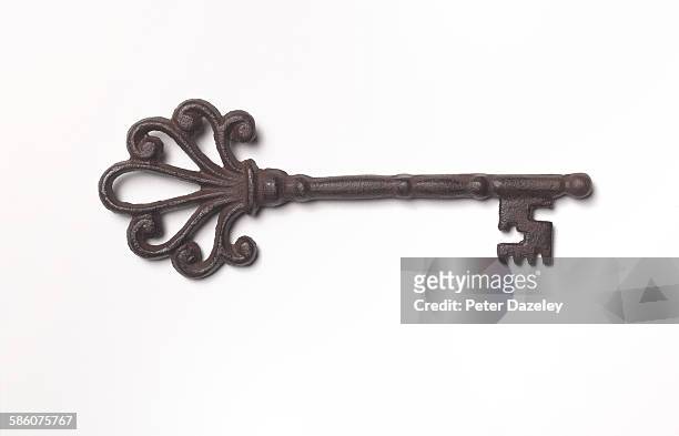 antique rusty key - key stock-fotos und bilder