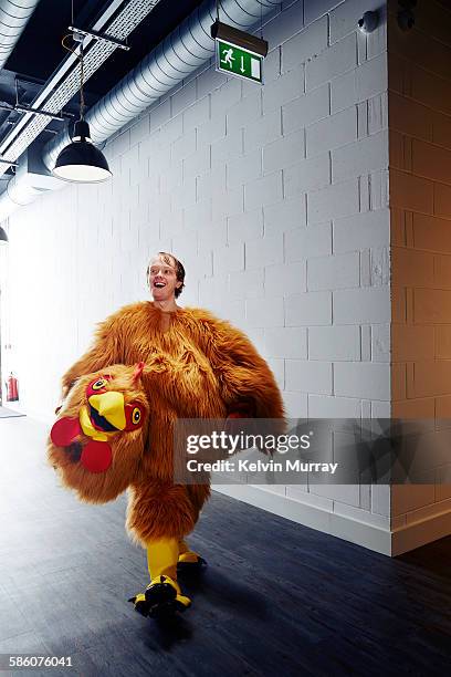 funny chicken costume mascot smiling after event - maskottchen stock-fotos und bilder