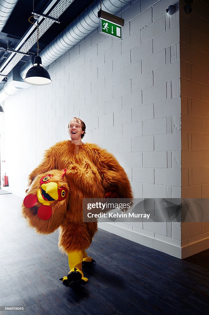 Funny chicken costume mascot smiling after event