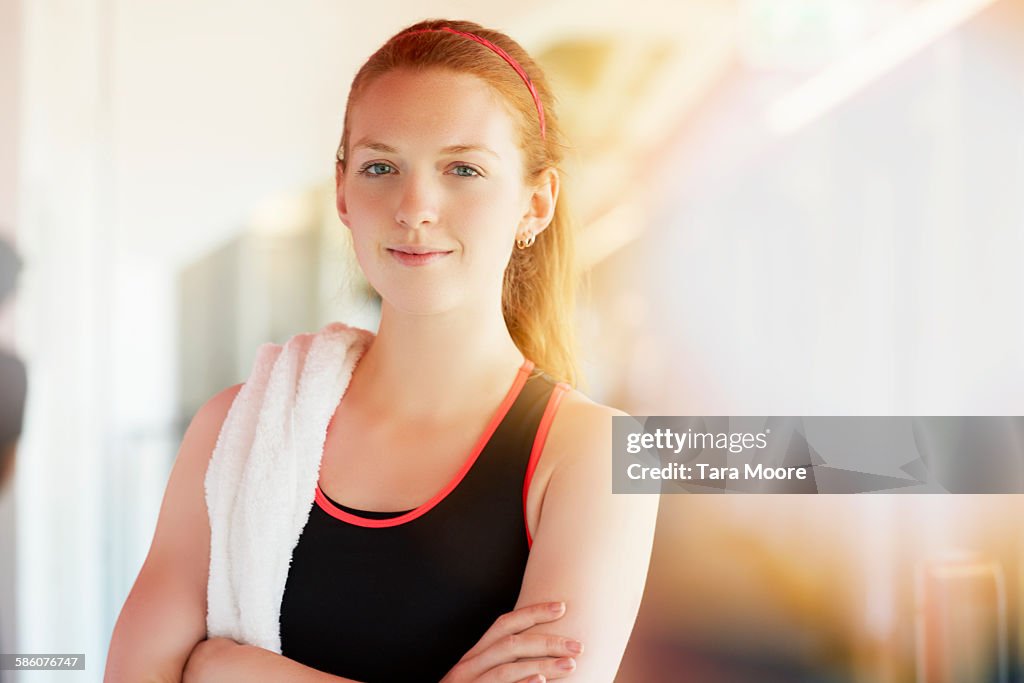 Sports woman in gym clothes in urban gym setting