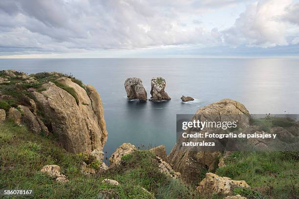 rocks in the sea - paisajes stock pictures, royalty-free photos & images