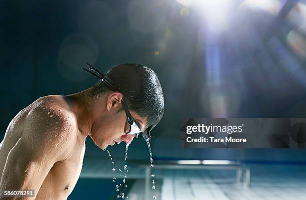 man getting out of pool - swimming goggles stock pictures, royalty-free photos & images
