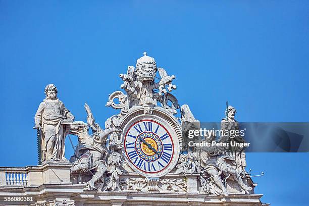 the clock at st. peters basilica, vatican, italy - papal tiara stock pictures, royalty-free photos & images