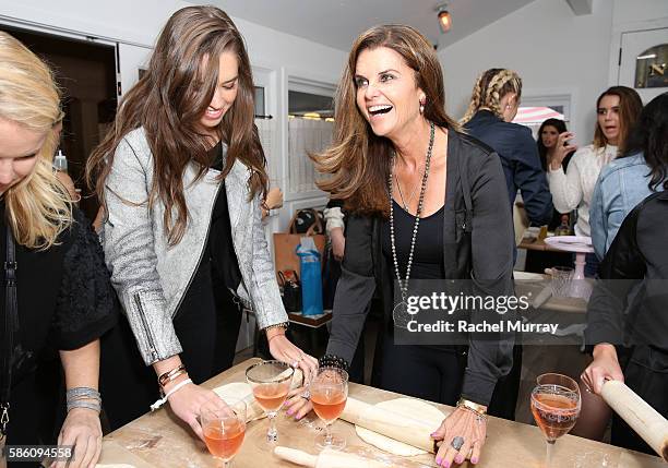 Maria Shriver and daughter Christina Schwarzenegger make pizza during Katherine Schwarzenegger's Amazon Echo cooking class at AU FUDGE on August 4,...