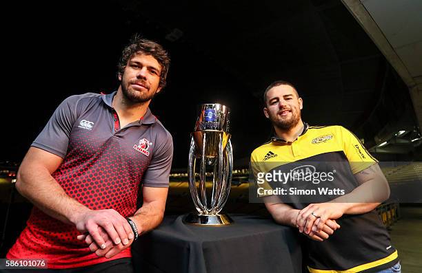 Lions captain Warren Whiteley and Hurricanes captain Dane Coles pose for a photo with the Super Rugby trophy during the Super Rugby Final media...