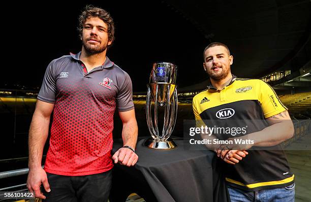 Lions captain Warren Whiteley and Hurricanes captain Dane Coles pose for a photo with the Super Rugby trophy during the Super Rugby Final media...