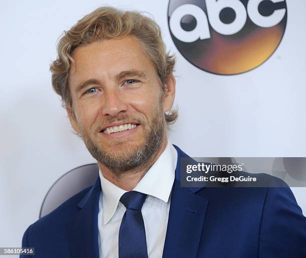 Actor Brett Tucker arrives at the Disney ABC Television Group TCA Summer Press Tour at the Beverly Hilton Hotel on August 4, 2016 in Beverly Hills,...