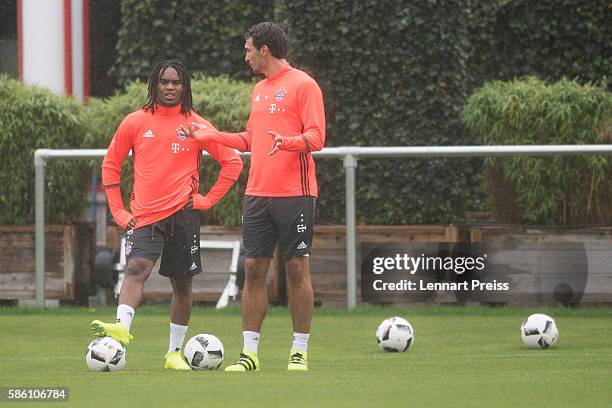 Mats Hummels and Renato Sanches talk to each other during a training session of FC Bayern Muenchen on August 5, 2016 in Munich, Germany.