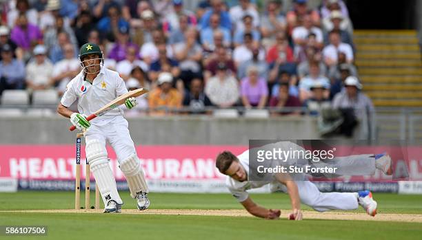 England bowler Chris Woakes fields off his own bowling off a drive from Pakistan batsman Younis Khan during day 3 of the 3rd Investec Test Match...