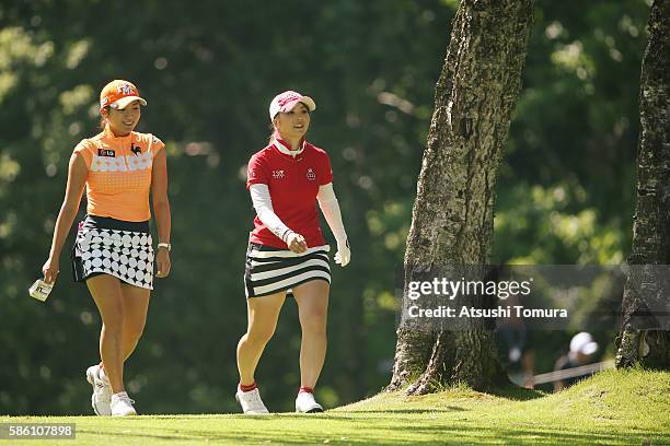 Bo-Mee Lee of South Korea and Erika Kikuchi of Japan smile during the first round of the meiji Cup 2016 at the Sapporo Kokusai Country Club on July...