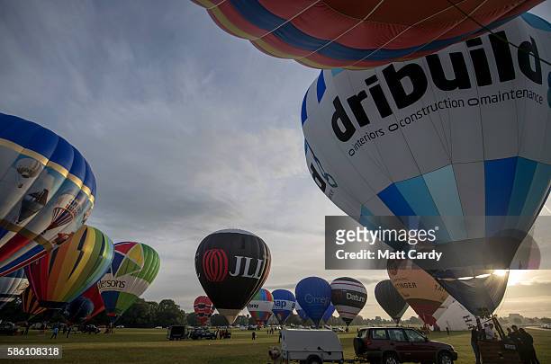 Hot air balloons take to the skies at a preview flight to launch next week's Bristol International Balloon Fiesta on August 5, 2016 in Bristol,...