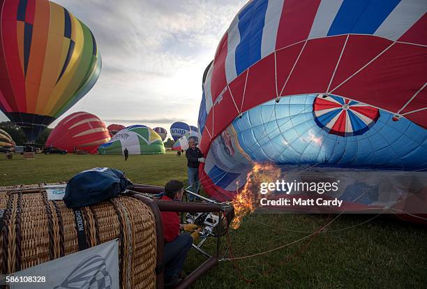 Hot air balloons take to the skies at a preview flight to launch next week's Bristol International Balloon Fiesta on August 5, 2016 in Bristol,...