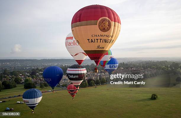 Hot air balloons take to the skies at a preview flight to launch next week's Bristol International Balloon Fiesta on August 5, 2016 in Bristol,...