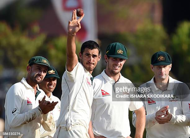 Australian cricketer Mitchell Starc acknowledges the crowd after taking a haul of five Sri Lankan wickets during the second day of the second Test...
