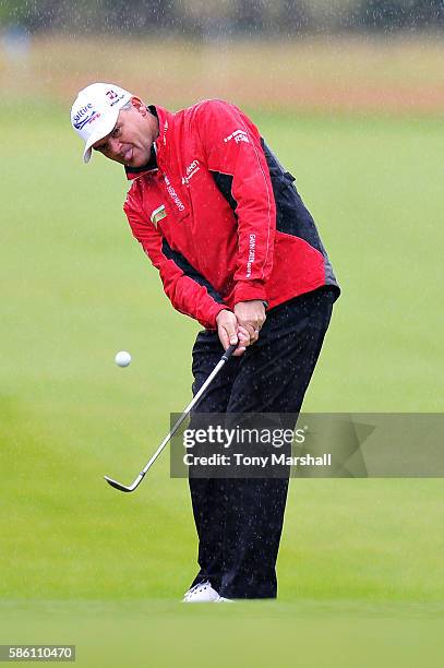 Paul Lawrie of Scotland chips onto the green at hole 1 on day two of the Aberdeen Asset Management Paul Lawrie Matchplay at Archerfield Links Golf...