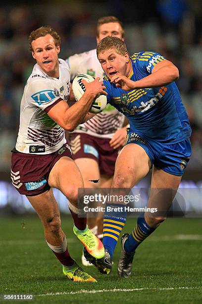 Daly Cherry-Evans of Manly makes a break during the round 22 NRL match between the Parramatta Eels and the Manly Sea Eagles at Pirtek Stadium on...