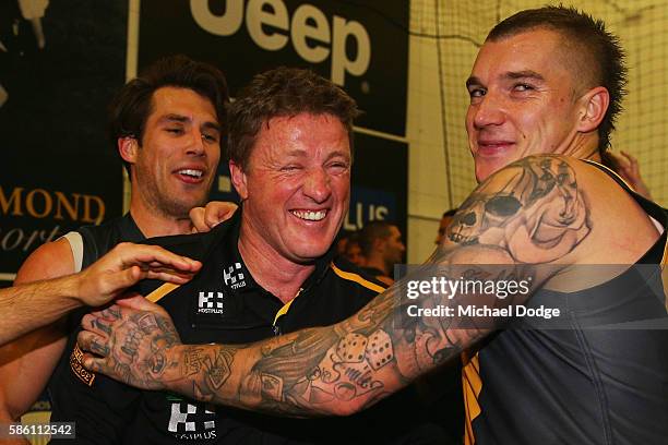 Tigers head coach Damien Hardwick celebrates the win with Dustin Martin of the Tigers during the round 20 AFL match between the Richmond Tigers and...