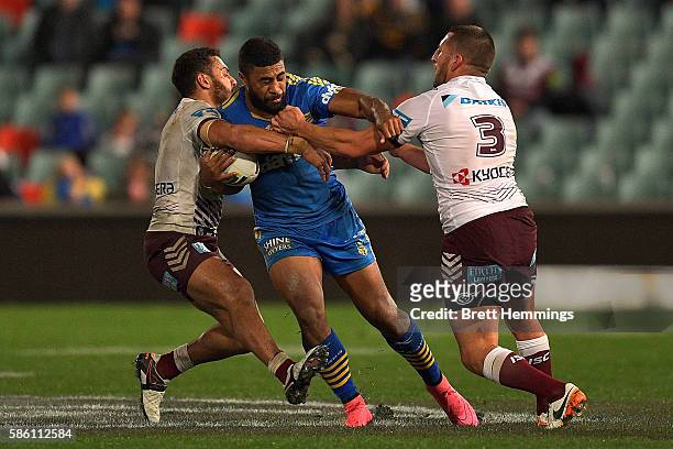 Michael Jennings of the Eels is tackled during the round 22 NRL match between the Parramatta Eels and the Manly Sea Eagles at Pirtek Stadium on...