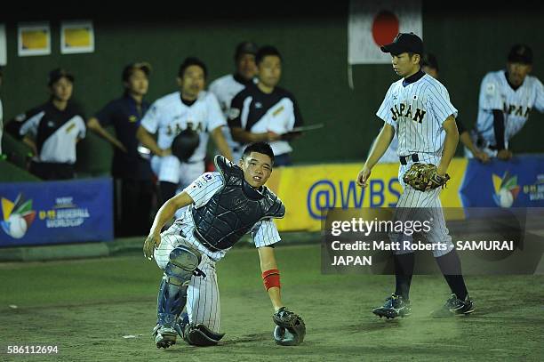 Minon Noguchi of Japan looks dejected after dropping a catch in foul territory in the top half of the nineth inning in the super round game between...