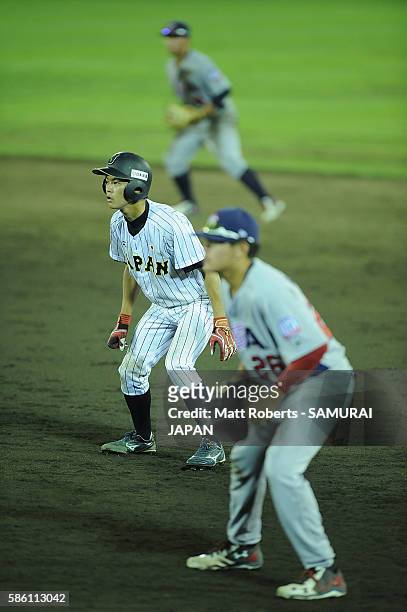 Kenshin Tsuji of Japan looks to steal second base in the bottom half of the nineth inning in the super round game between Japan and USA during The...